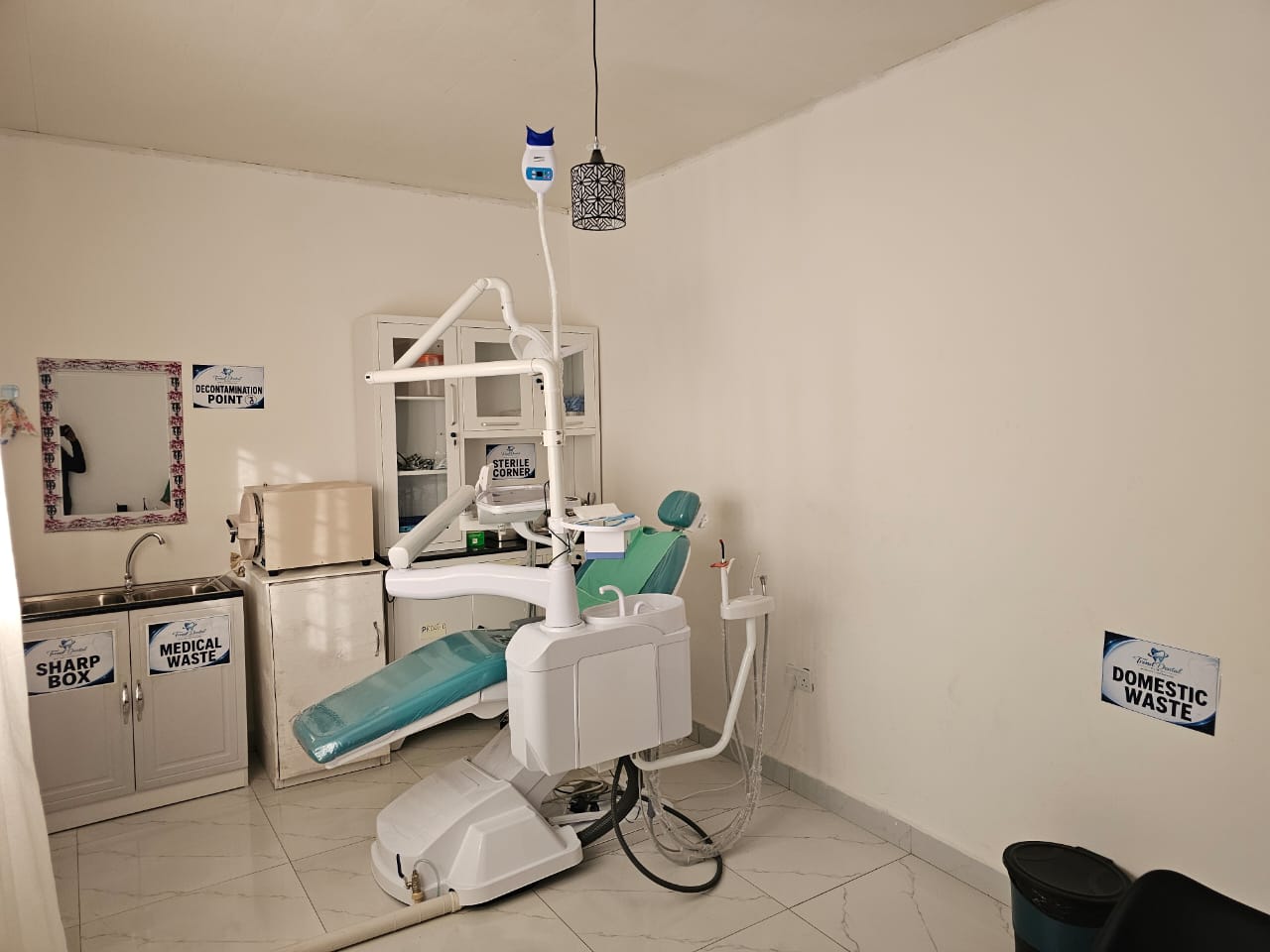 Modern treatment room with dental chair and equipment at Trend Dental Clinic