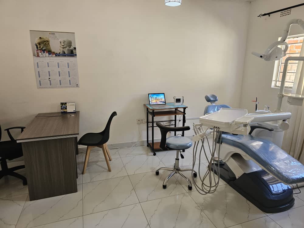 Consultation desk beside a dental treatment chair